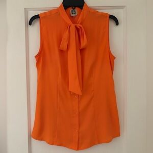 Orange sleeveless blouse in medium